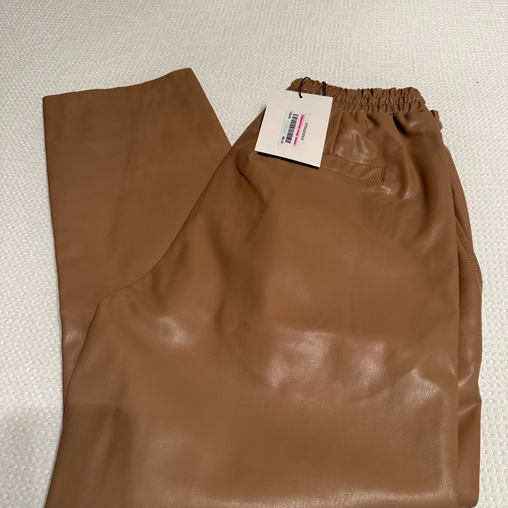 NWT faux leather straight leg pant. Elastic waist size medium.